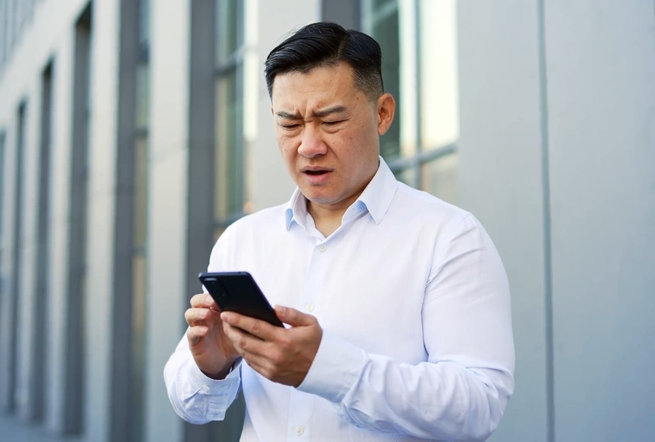 Stressed Property Agent Taking Client Phone Call